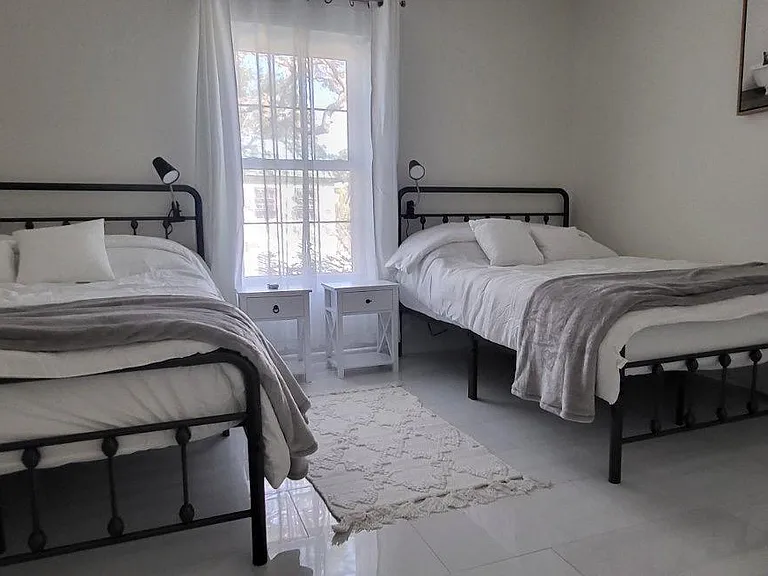 Guest bedroom with two full beds
