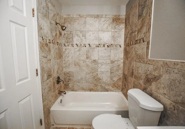 Head upstairs to find 2 bedrooms, a den, and bathroom