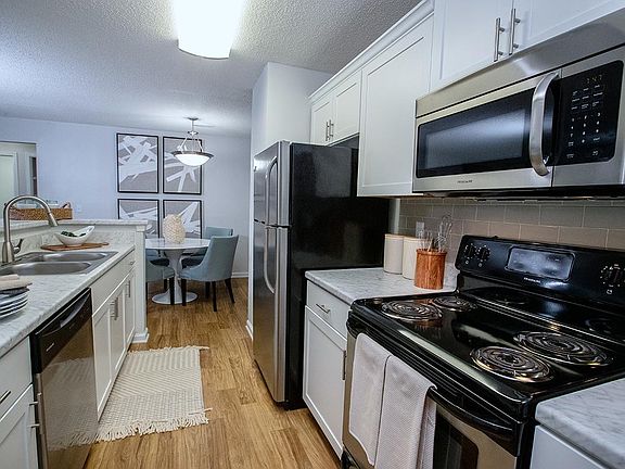Kitchens feature stainless steel appliances including a dishwasher, microwave, stove and refrigerator - everything you need!