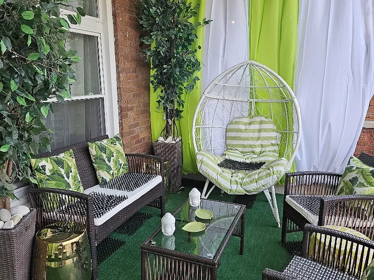 Front porch and curtains for privacy.