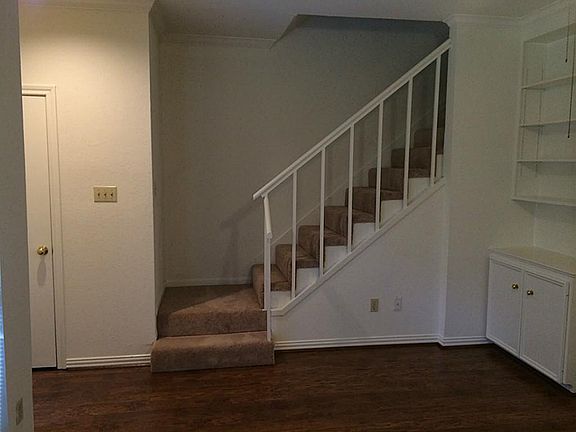 From your new living room, your view of the staircase and powder room entry.
