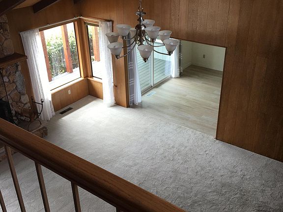 View from catwalk as you descend into the living room from the split level upstairs bedrooms.