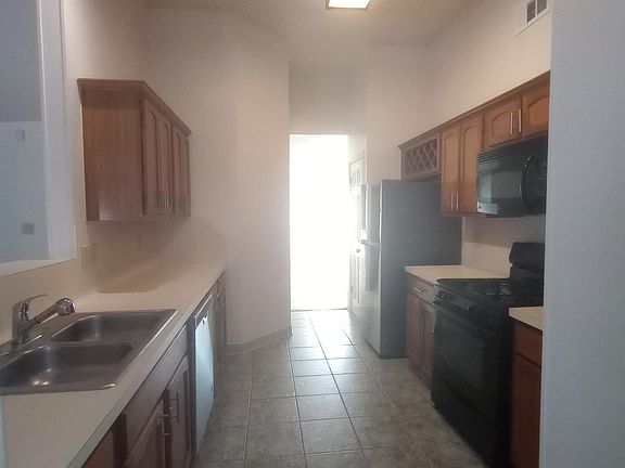 Kitchen with wine rack, abundant counter space and cabinets