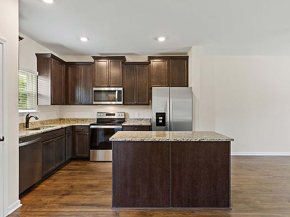 Enjoy the added prep space of a center kitchen island in the Benton plan.