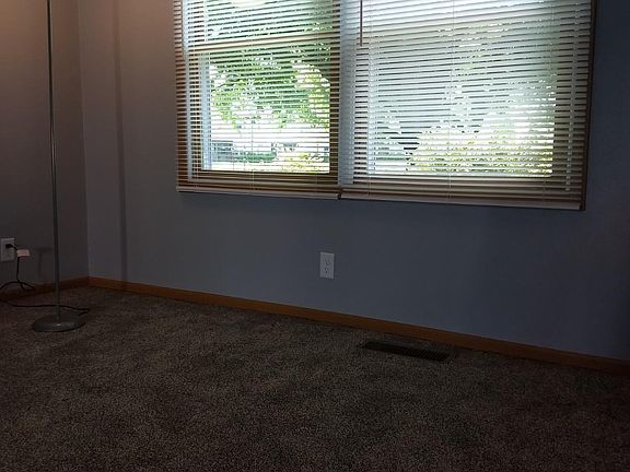 Living room windows looking out to the front of the condo