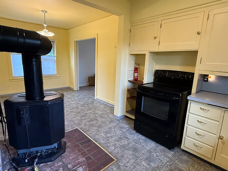 Kitchen with propane heater looking towards dining room