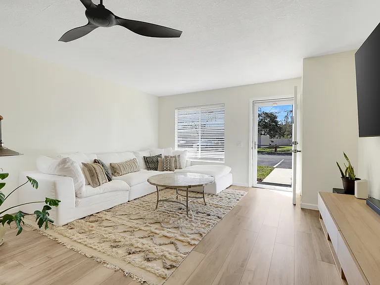 Expansive living area featuring large windows and excellent natural light throughout.
