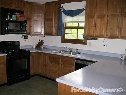 U-Shaped Kitchen
						:
						42-inch oak cabinets, pantry, breakfast bar. New stove and refrigerator.