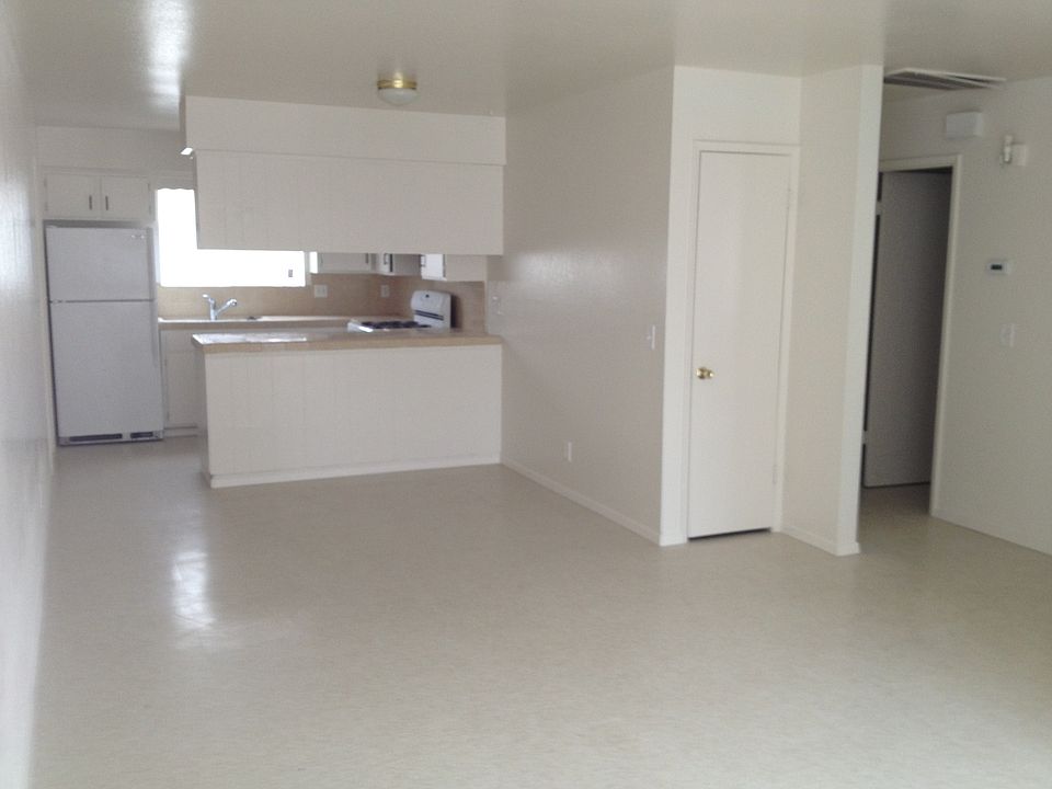 living room, kitchen in back and bedrooms to right