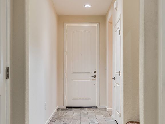 Front Door, Entry Hall. A bedroom and a full bathroom are located to the right.