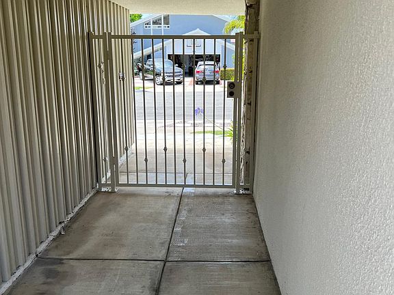 Private, gated entry front door looking out to street