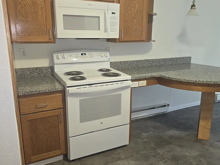 Electric stove with over the stove microwave