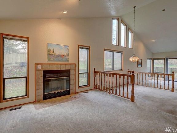 Wood burning with tile surround has never been used.  Blower switch on wall next to fireplace.