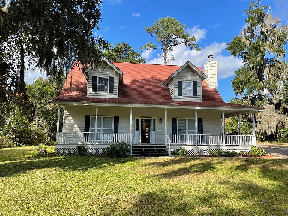 front of the house with wrap around porch