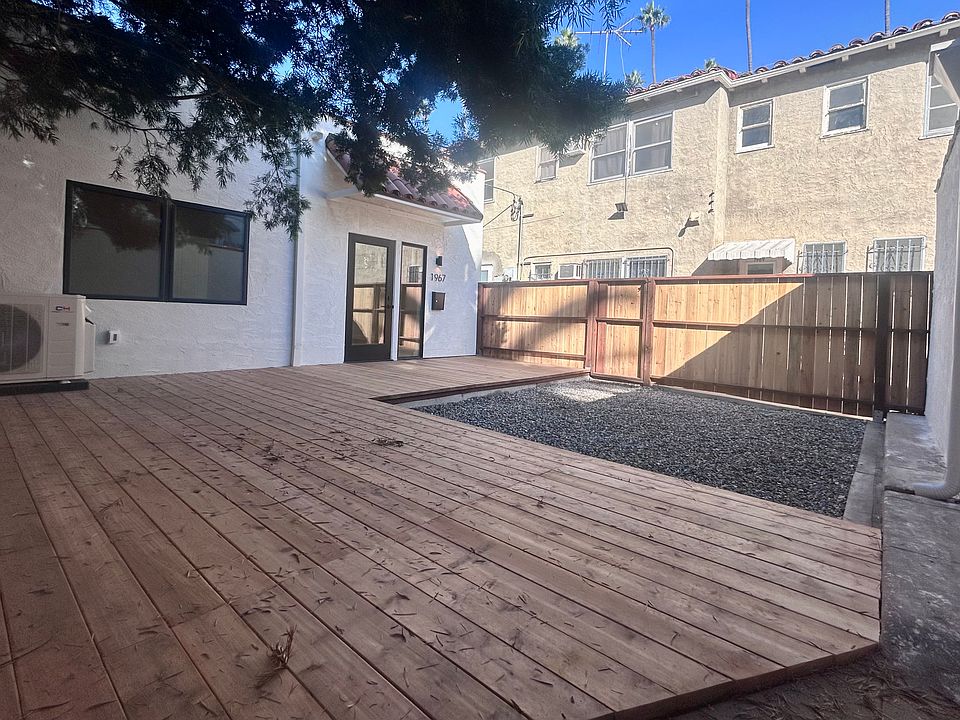Private fenced deck and yard.