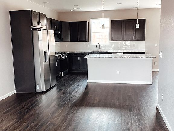 Living Room Leads into the Kitchen