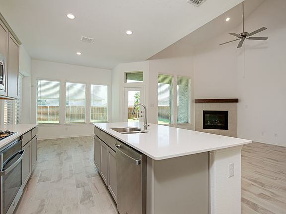 Open-concept kitchen with sleek quartz countertops