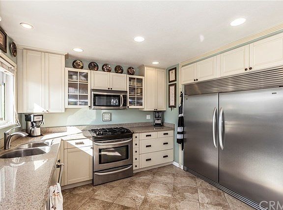 This kitchen has all top of the line SS appliances.  Features this CUSTOM DOUBLE SIZED Fridge!