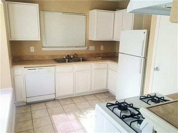 Tile floor in kitchen & living room area.