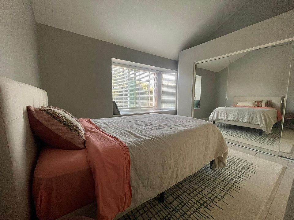 Bedroom with in-window seating alcove and extra large closet