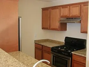 View from breakfast bar into kitchen.