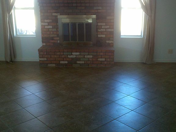 Tiled living room w/fireplac