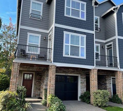Front of unit. Long designated additional parking space to left of unit.