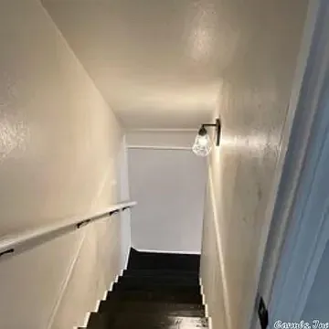 This is the stair well which has a door at the top for privacy. - 203 Patriot St