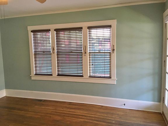 The north facing wall in the living room has a wonderful, large window with privacy blinds.