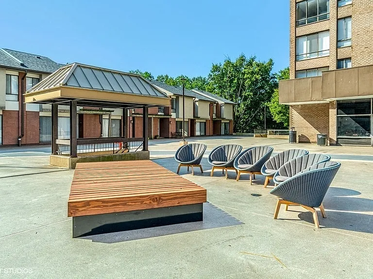 Lounge on the plaza with fellow residents and your guests