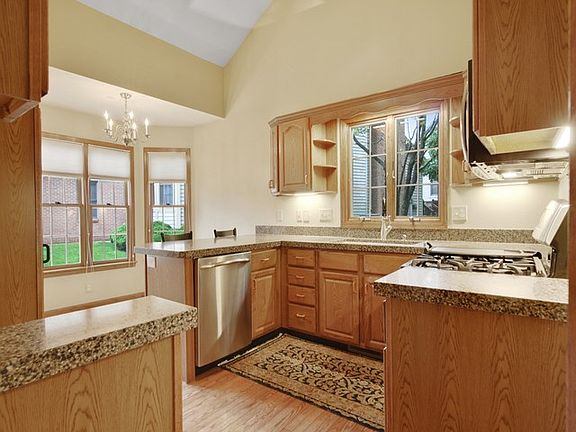 Kitchen w/vaulted ceiling.
