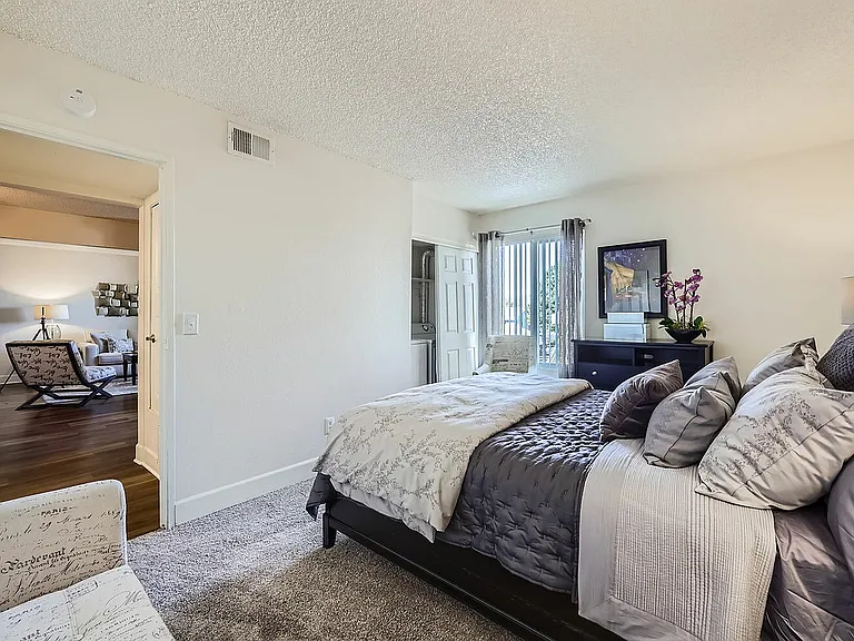 Experience the comfort and style of this chic bedroom, designed for relaxation and convenience.