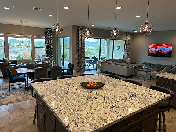Expansive open concept kitchen, dining, sunroom and living room. All with fantastic views of the mountains