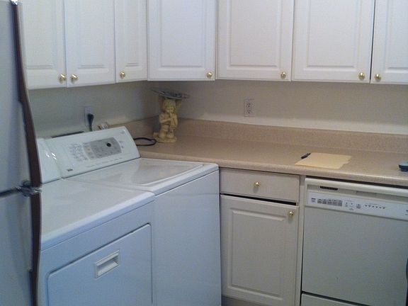 kitchen with washer and dryer onsite
