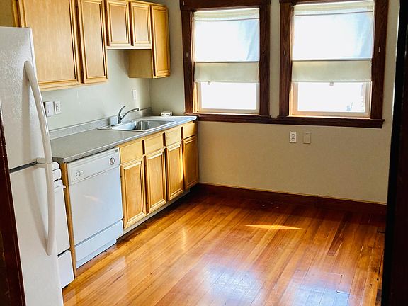 Large, light-filled kitchen with pantry and breakfast nook area.