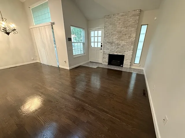 Electric fire place with real hardwood flooring throughout the first and second level