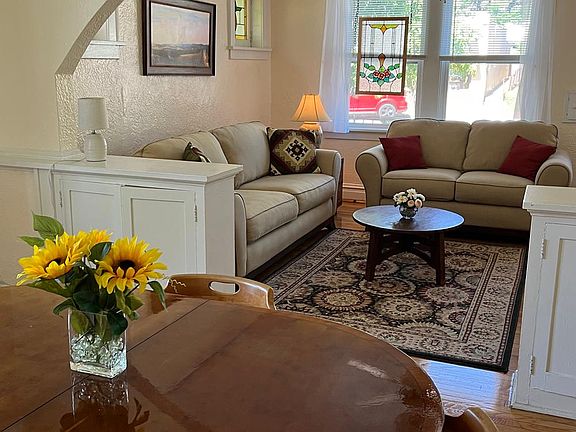 Graceful craftsman arch, built-in bookcases.