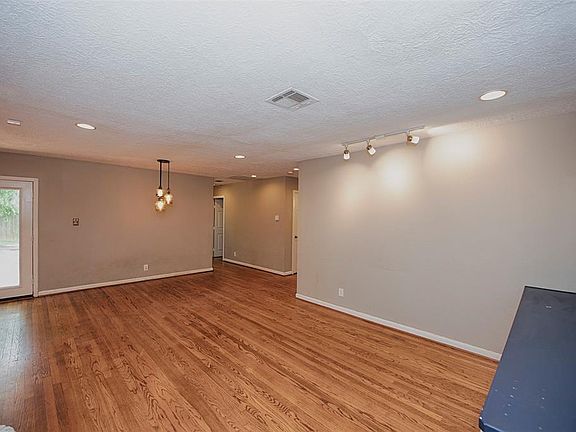 Upon entering, you see the open living/dining combination with gorgeous hardwood floors and updated recessed lighting and fixtures.