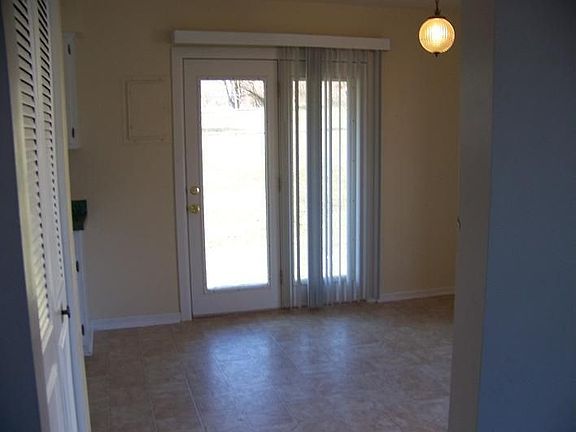 Dining area leads to backyard.