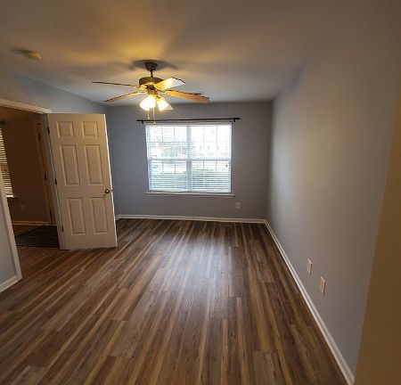 The first floor bedroom has plenty of closet space and a storage area.