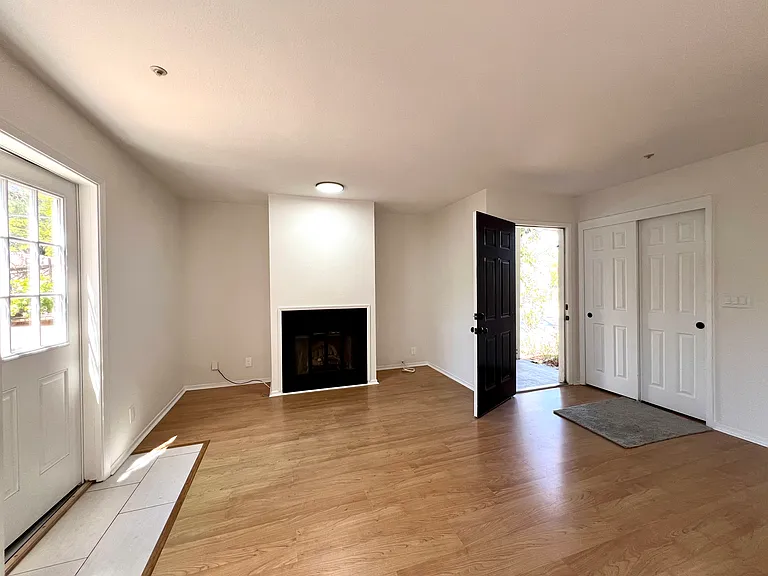 Extra storage under staircase located within closet