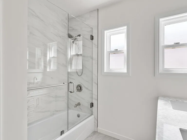 Brand new glass enclosed shower bath combo
