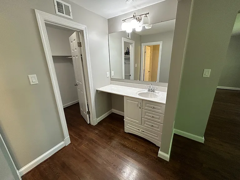 Master bedroom vanity and walk in closet.