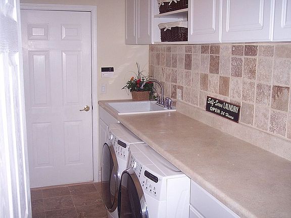 Newly Remodeled Laundry Room with Travertine Tile