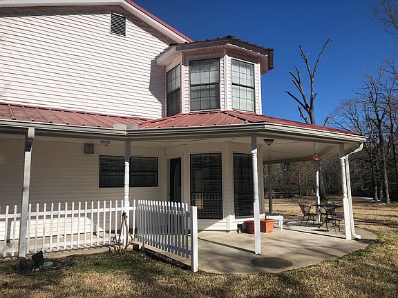 West end of home with breakfast nook and upstairs bedroom