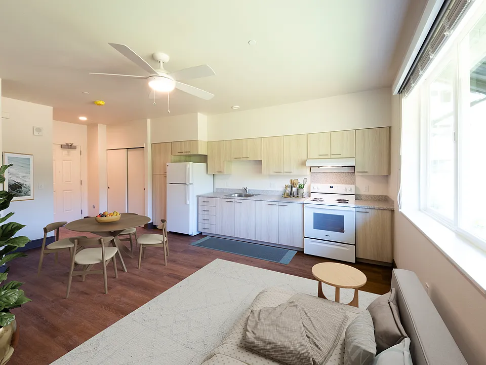 Airy studio with full kitchen, dining nook, and generous natural light.