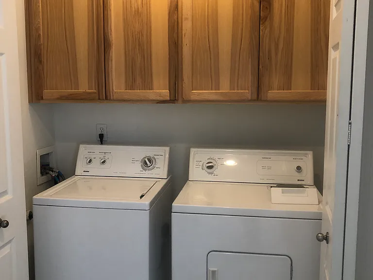 Washer and dryer in unit, next to bedrooms, for convenience.
