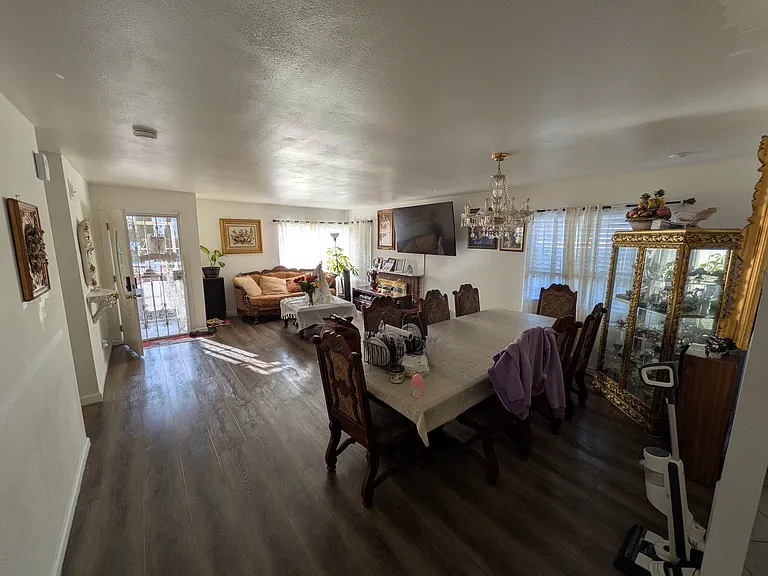 Shot of the main entrance, living/ dining area from the indoor kitchen.