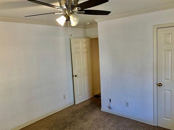 Living room facing the hall closet.