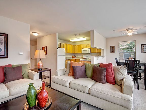 A cozy living room with easy access to the kitchen